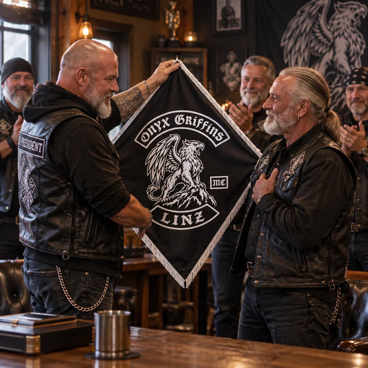 A chapter president presents a custom diamond flag to a veteran motorcycle club member during a clubhouse ceremony.