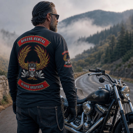 Motorcycle club rider wearing a custom long-sleeve shirt during a cool early-morning V-twin ride.