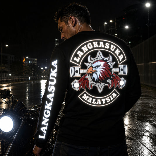 Reflective motorcycle club graphics illuminated on a custom long-sleeve riding shirt at night.