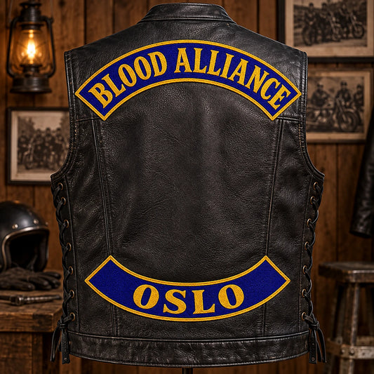 Complete leather motorcycle vest displaying old-school chain-stitch top and bottom rocker patches.