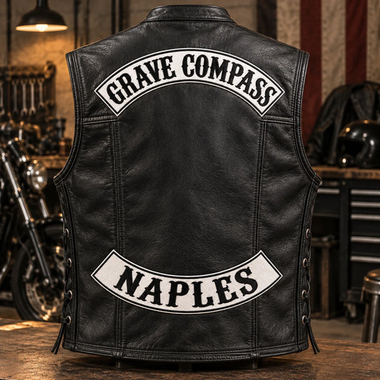 Complete black leather motorcycle vest displaying coordinated top and bottom rocker patches.