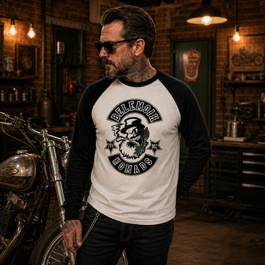 Custom motorcycle club raglan long-sleeve shirt with contrasting sleeves in a vintage American garage.