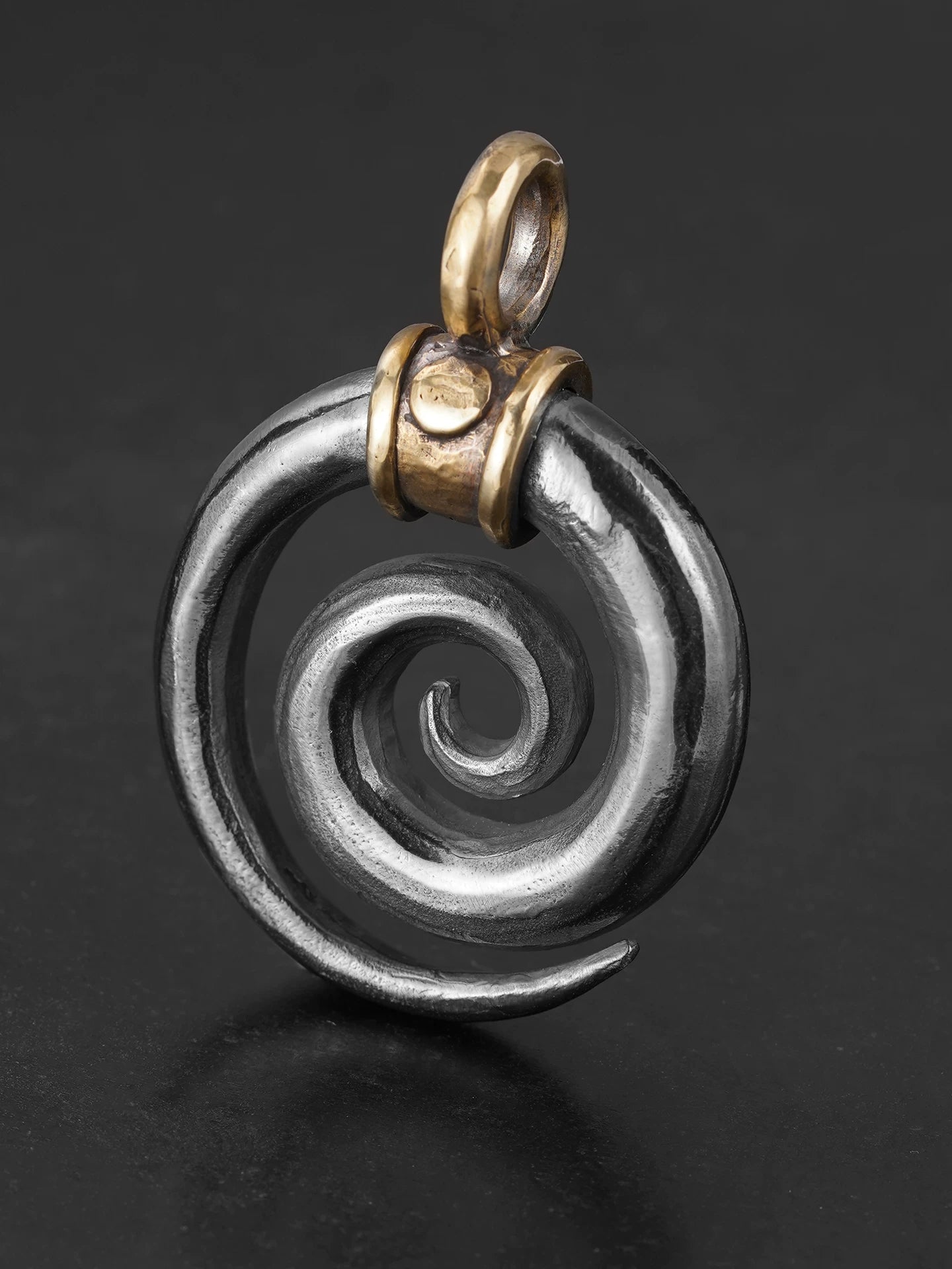 Front view of handcrafted Viking spiral sterling silver pendant
