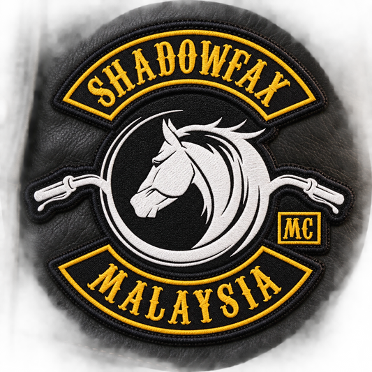 Solid woven patch with small lettering detail shown for a custom motorcycle club patch system in bright inspection station.