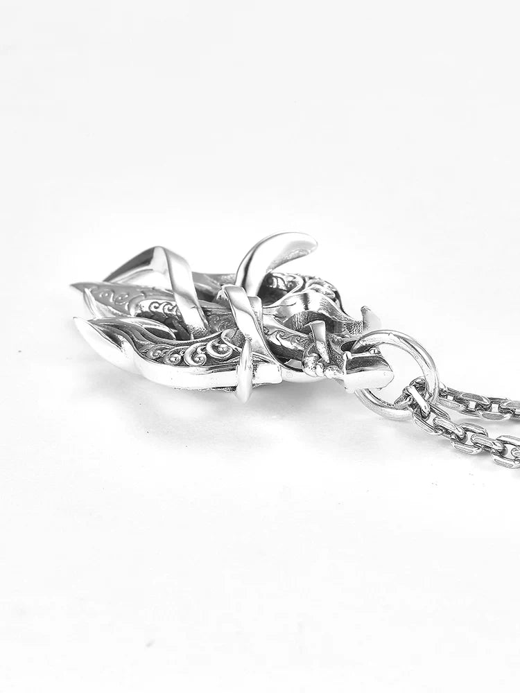 Rear detail of wrapped trident pendant with sterling silver chain